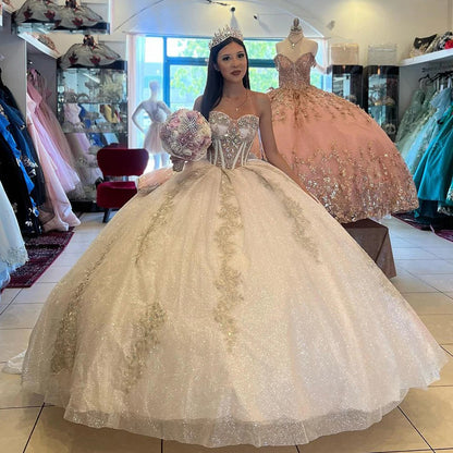 Champagne Quinceanera Dresses with Puff Sleeves Off Shoulder Corset Ball Gown Lace Appliques Sweetheart Beaded Glitter Tulle Princess Party Gown